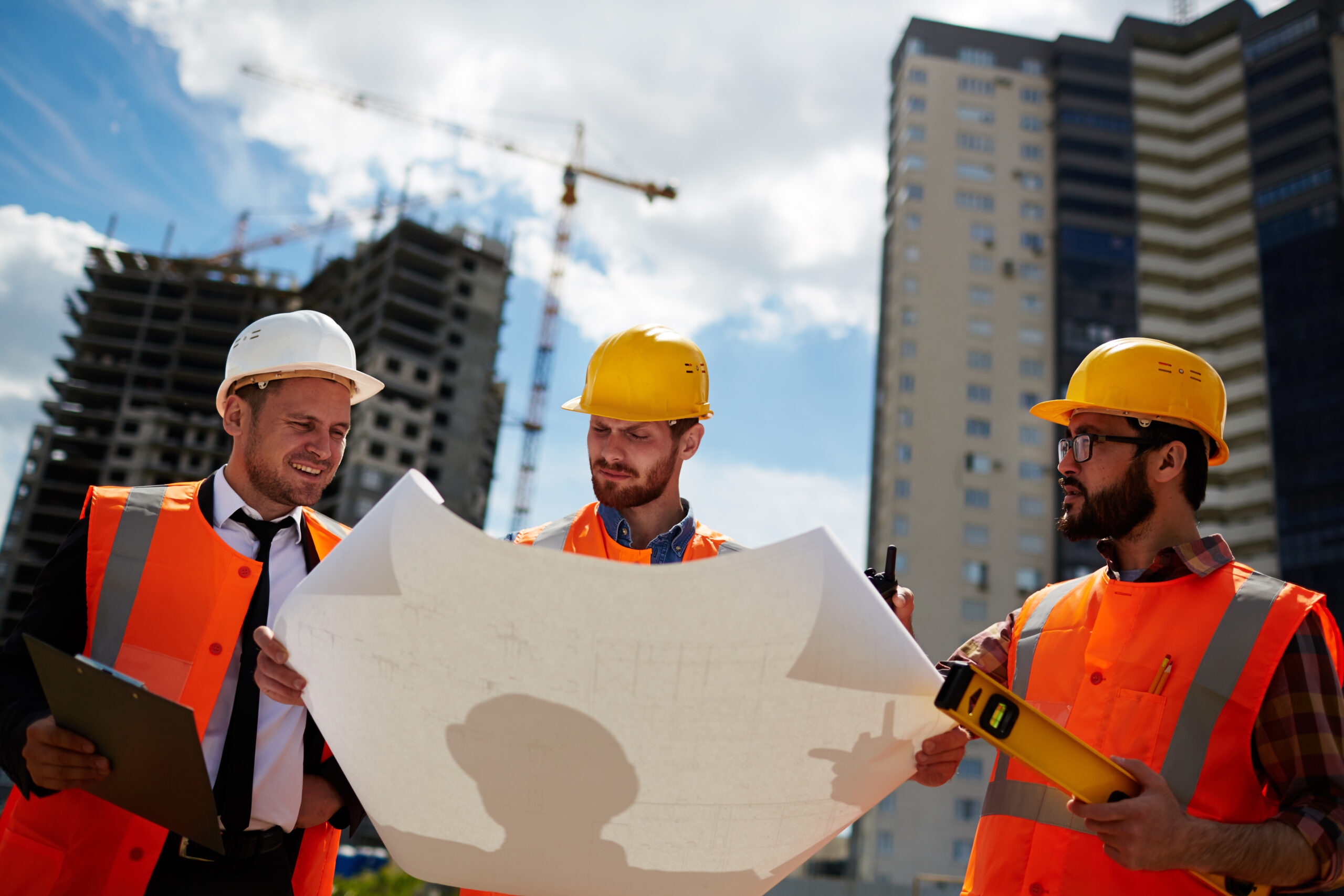 construction workers looking at a blueprint